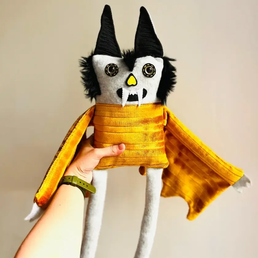 Skittles - Black & Gold Bat Doll